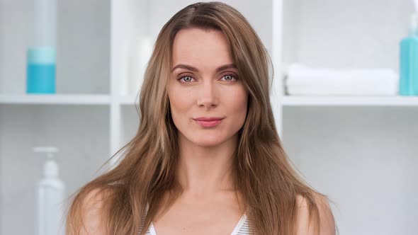 Portrait of Charming Lady Posing at White Bathroom Interior alt