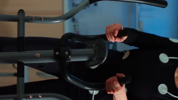 Vertical Video Team of Doctor Researchers Monitoring Endurance of Woman Performance Sports alt