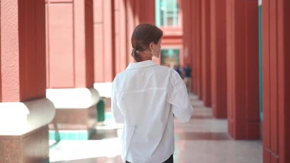 Businesswoman Successful Female Business Person Walking Outdoor Back View Turn Around alt