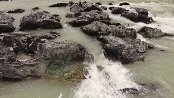Stones Located in the Middle of a Turbulent River alt