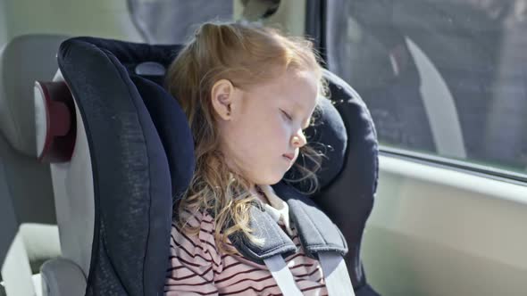 Little Girl Taking Nap in Car Seat by Pressmaster | VideoHive Little Girl Taking Nap in Car Seat by Pressmaster | VideoHive