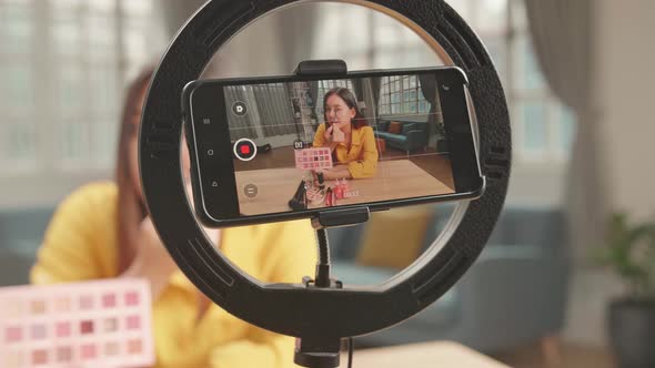 Display Of Smartphone Recording Video Blog For Asia Beauty Blogger Woman With Make-Up At Home Studio alt
