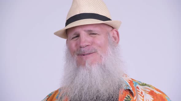 Face of Happy Mature Bearded Tourist Man Smiling and Talking alt