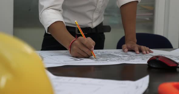 Architect Working On Blueprint alt