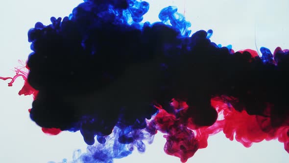 Red And Blue Ink Mixing In Water On A White Background alt