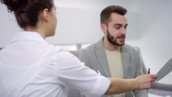 Female Orthodontist Having Consultation with Patient alt