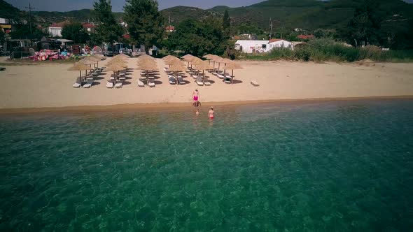 Family on beach in Sithonia, Greece