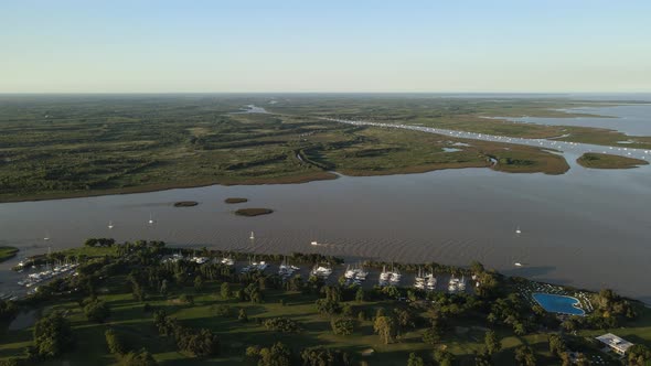 Aerial establishing shot of a river mouth to La Plata river in San Isidro, Buenos Aires alt