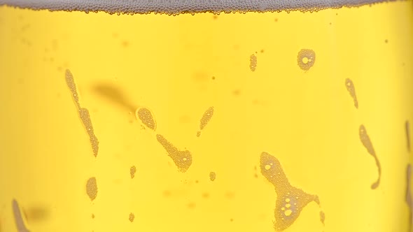 Pouring lager beer in a glass alt