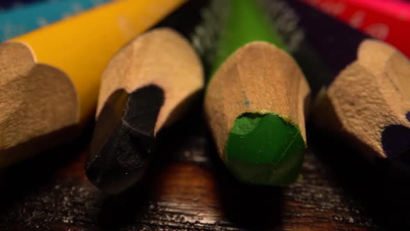 Many Colored Pencils Lie in Row. Sliding Over Pencils on Table. Macro Shot on Laowa Lens. alt
