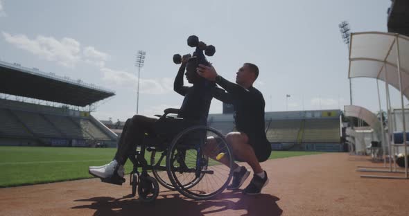Wheelchaired Man Doing Overhead Presses alt