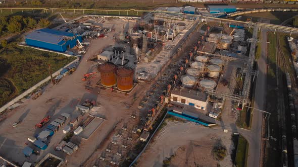 Aerial View. Industrial Area with Factories and Rail Freight Line. Factories, Freight Trains and alt
