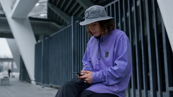 Serious Man Touching Phone Screen Outdoor alt