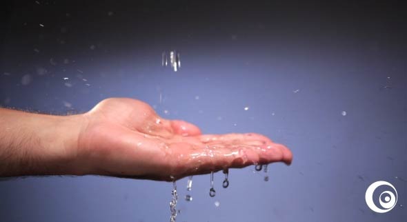 Male Hand Catches Water