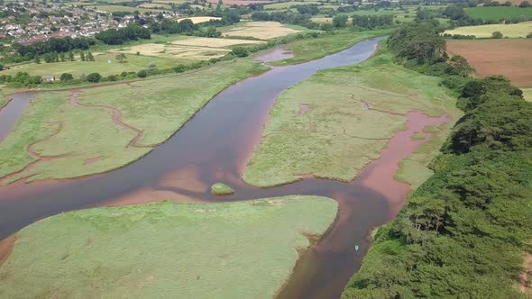 4K, Aerial pan of River Otter by the coastal town Budleigh Salterton in Devon, UK alt