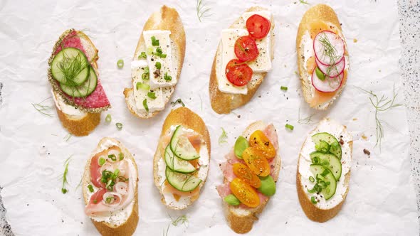 Variety of Small Sandwiches with Cream Cheese Vegetables and Salami