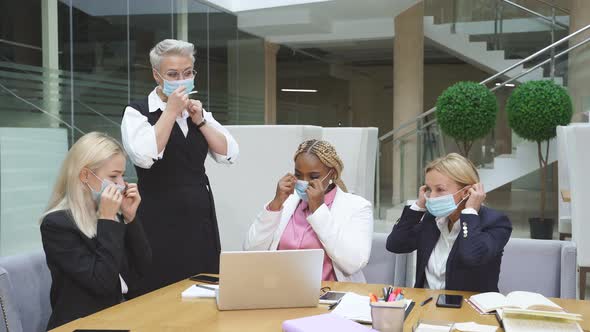 Business Team Having Biz Negotiations in Office, Wearing Masks During Coronavirus Pandemic alt