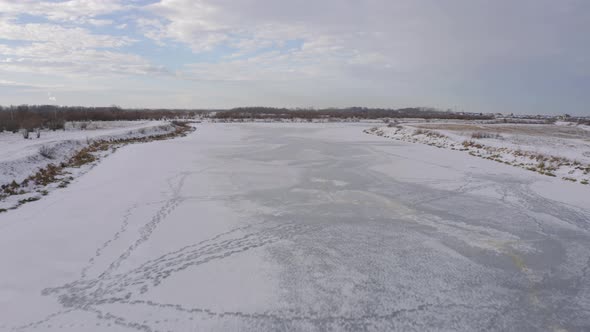 Aerial Footage of an Ice Covered River on a Winter Day