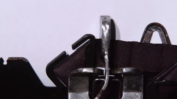 Word the End of a Book Printed By a Retro Typewriter. Close Up alt