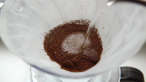 Barista Pours Water Into the Filter with Coffee Brewing Alternative Coffee