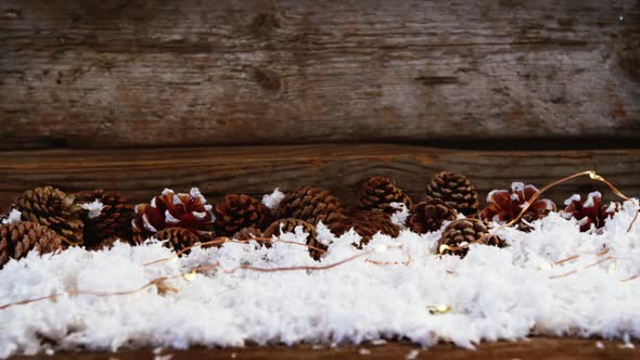 Pine cones decoration on fake snow alt