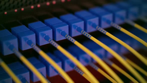 Endless array of optic cables connected to the router ports. Loopable. HD alt