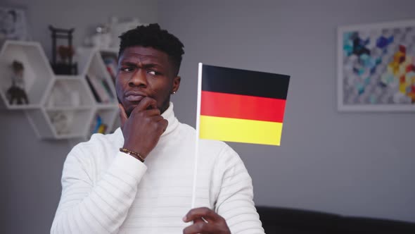 Young Black Man with German Flag. Student Exchange Program or Work Relocation Concept alt