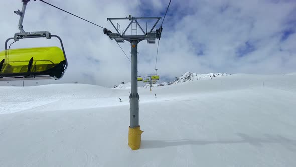 Chair Lifts In Action In Ski Areas In The Swiss Alps alt
