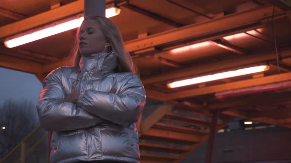 Teenage Blond Girl In Silver Puffer Jacket alt