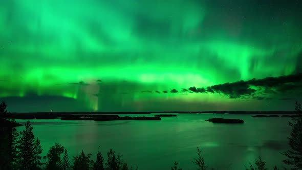 Timelapse of aurora borealis, a magnetic solar phenomenon, above lake Hoytianen, on a cold autumn ni alt