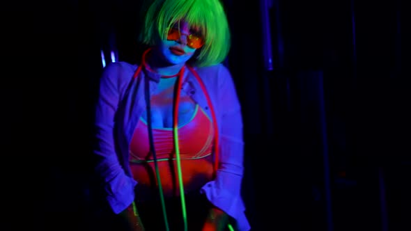Gogo Dancer Woman in Nightclub Woman with Fluorescent Makeup and Neon Wig alt