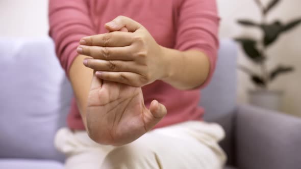 Women doing hands stretching after intense home office day protect office syndrome. Health care conc alt