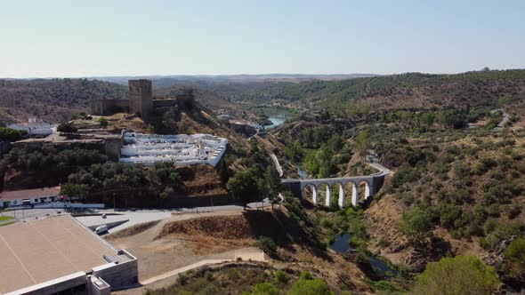 Mertola Castle And Bridge From Ermida de Nossa Senhora das Neves In Portugal. - aerial approach alt