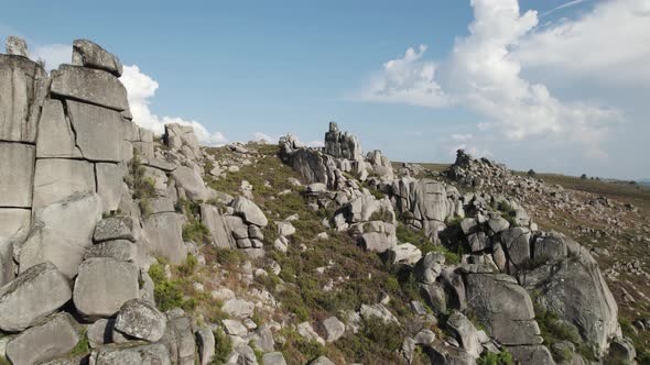 Dolly in shot through granitic rock formation, geology background with no people, Geres park