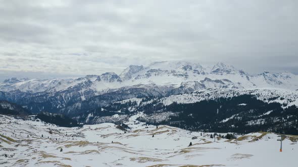 Aerial, Beautiful View On Snowy Dolomites Mountains, On A Cloudy Day In Italy