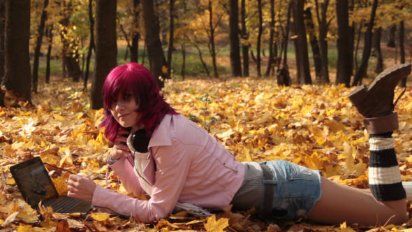 Girl Listening to Music in Park