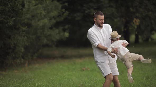 Father Playing with His Child in the Glade