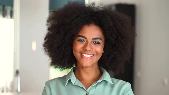 Headshot of a Young African American Ethnic Female with Afro Curly Hairstyle