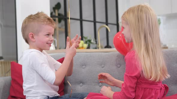 Little Boy Gives His Beloved Girl Valentines Day Red Heart Shapes Balloons alt