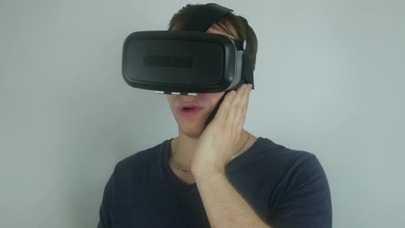 Man In A Modern Helmet Of Virtual Reality Speaks On The Phone
