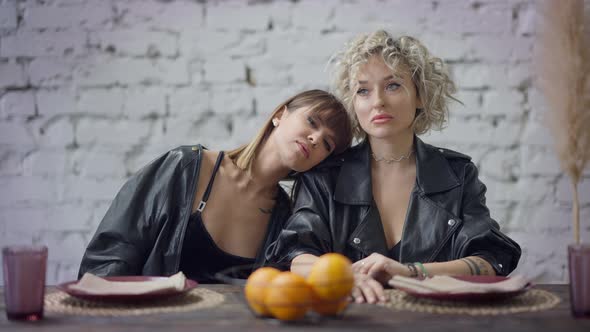 Sensual Serious Lesbian Woman Touching Face of Partner Putting Head on Her Shoulder in Slow Motion alt