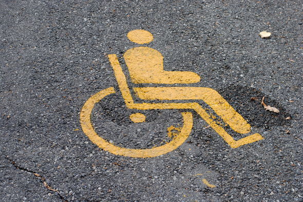 yellow road marking for disabled and invalid parking