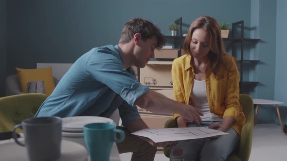 Young couple making plans for their new home