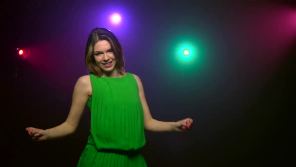 Close-up Dancing of Young Woman in Green Dress. Slow Motion alt