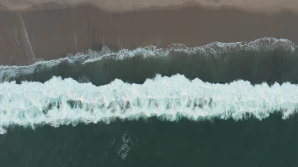 Aerial view of waves crashing on to the shore by Walton Light House, Santa Cruz California, Highway alt