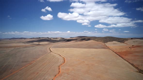 Clouds Rolling in the Sky and Shadows Cast on the Vast Horizon alt