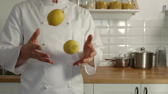 Chief-Cooker Juggles A Lemons In A Kitchen