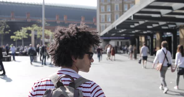 Man walking to the train station alt
