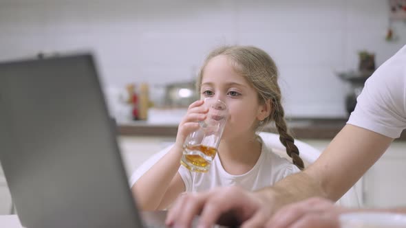 Closeup Portrait of Charming Beautiful Caucasian Girl Drinking Juice in the Morning Looking at alt