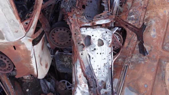 Vertical Video of a Dump of Cars Destroyed By the War in Ukraine alt